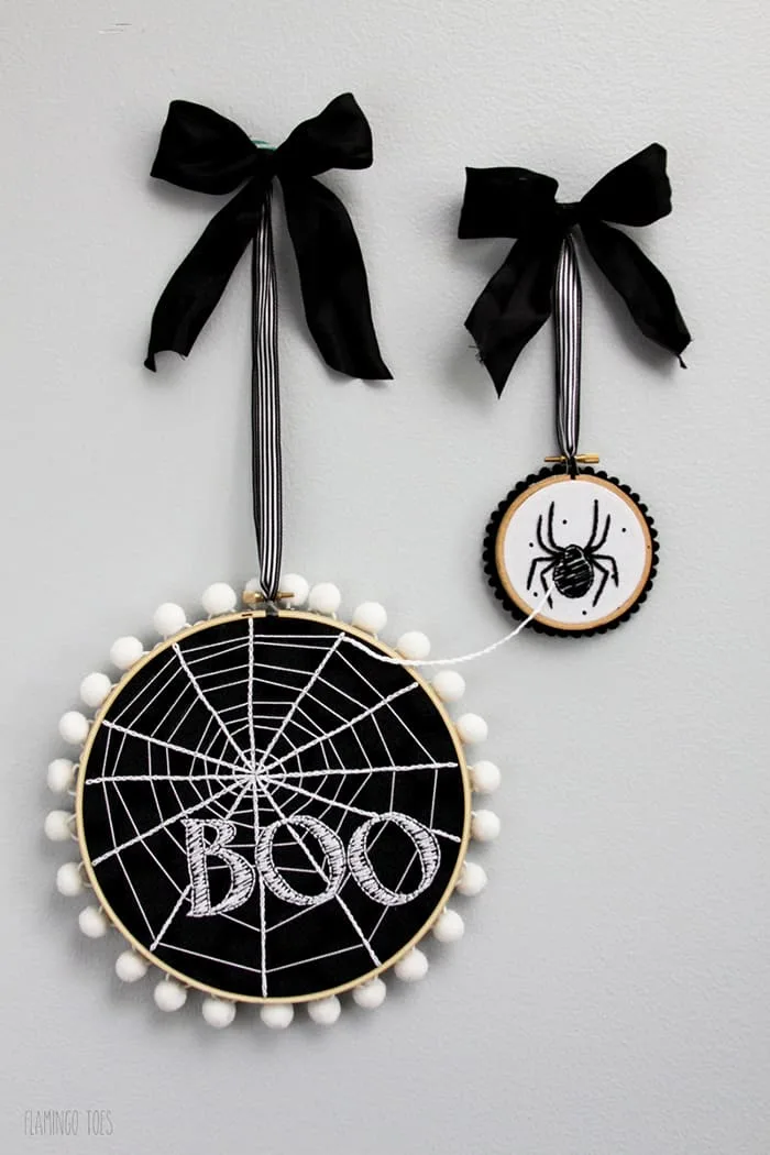 Two small Halloween ghosts diy, white and black felt sheets, scissors,  thread, needle on lilac wooden background. Home Halloween decor project for  kids. Sewing craft inspiration Stock Photo by ©OnlyZoia 119641586