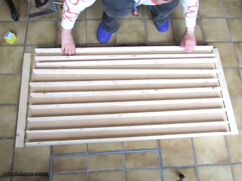 Organize nails to create a toy car display rack.