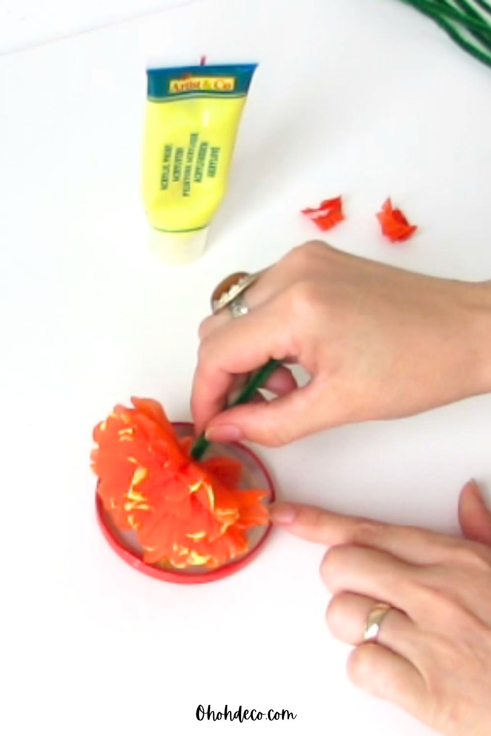 tip of the marigold petals into the paint